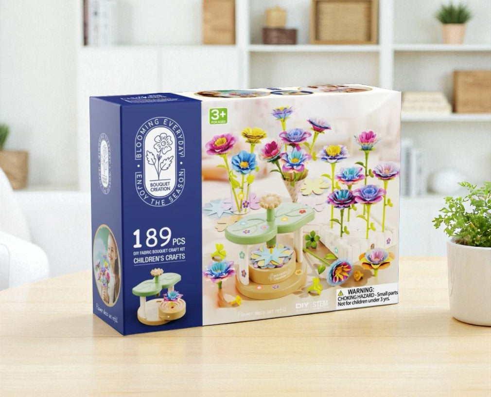 Children's craft set packaging with colorful flowers on a wooden table