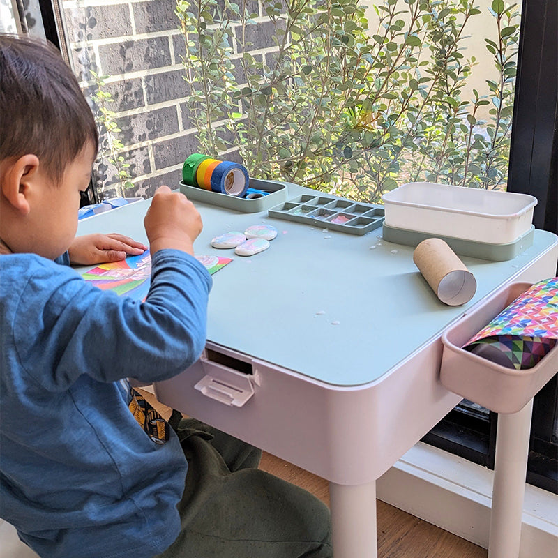 Toddler using silicone art mat for painting, arts and crafts activity